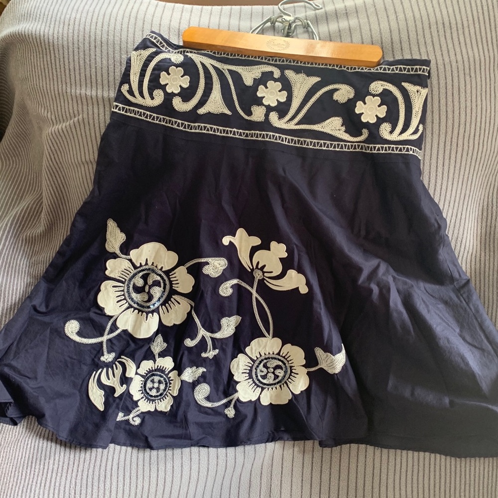 Navy blue skirt with floral appliqué